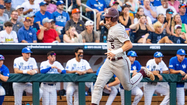 Jun 17, 2024; Omaha, NE, USA; Texas A&M Aggies designated hitter Hayden Schott (5) celebrates as he scores a run against the Kentucky Wildcats during the sixth inning at Charles Schwab Field Omaha. Mandatory Credit: Dylan Widger-Imagn Images Jun 17, 2024; Omaha, NE, USA; Texas A&M Aggies designated hitter Hayden Schott (5) celebrates as he scores a run against the Kentucky Wildcats during the sixth inning at Charles Schwab Field Omaha. Mandatory Credit: Dylan Widger-Imagn Images