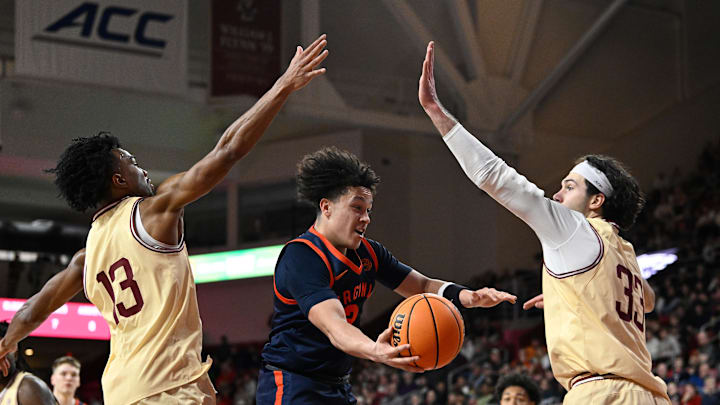 Jan 31, 2026; Chestnut Hill, Massachusetts, USA; Boston College Eagles guard Donald Hand Jr. (13) and Boston College Eagles center Boden Kapke (33) defend the basket from Virginia Cavaliers guard Chance Mallory (2) during the second half at Conte Forum. Mandatory Credit: Eric Canha-Imagn Images