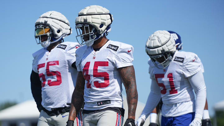 Jul 26, 2024; East Rutherford, NJ, USA; New York Giants linebackers Boogie Basham Jr. (55), Tomon Fox (45) and Azeez Ojulari (51) take to the field during training camp at Quest Diagnostics Training Center. Jul 26, 2024; East Rutherford, NJ, USA; New York Giants linebackers Boogie Basham Jr. (55), Tomon Fox (45) and Azeez Ojulari (51) take to the field during training camp at Quest Diagnostics Training Center.