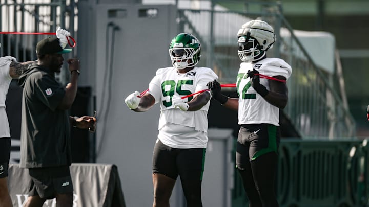 Jul 25, 2025; Florham Park, NJ, USA; New York Jets defensive tackle Quinnen Williams (95) and defensive end Micheal Clemons (72) warm up during training camp at Atlantic Health Jets Training Center. Mandatory Credit: John Jones-Imagn Images