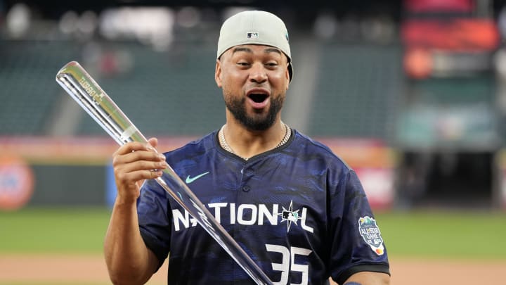 Jul 11, 2023; Seattle, Washington, USA; National League catcher  Elias Díaz of the Colorado Rockies (35) poses with the Ted Williams All-Star Game MVP trophy after the game at T-Mobile Park.