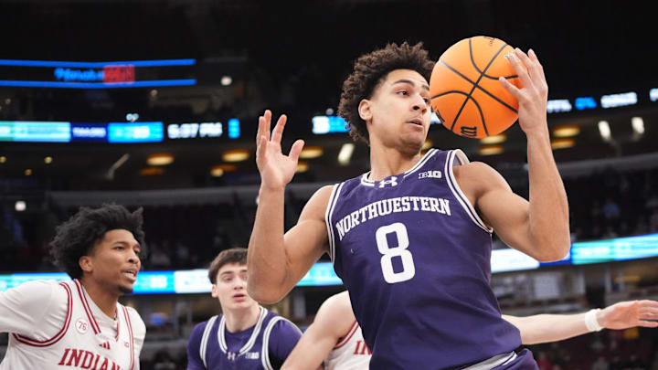 Mar 11, 2026; Chicago, IL, USA; Northwestern Wildcats forward Tre Singleton (8) grabs a rebound against the Indiana Hoosiers during the first half at United Center. Mandatory Credit: David Banks-Imagn Images