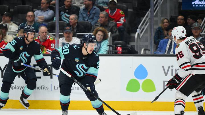 Apr 4, 2026; Seattle, Washington, USA; Seattle Kraken right wing Eeli Tolvanen (20) plays the puck during the second period against the Chicago Blackhawks at Climate Pledge Arena. Mandatory Credit: Steven Bisig-Imagn Images