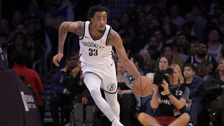 Brooklyn Nets center Nic Claxton handles the ball against the Los Angeles Lakers.