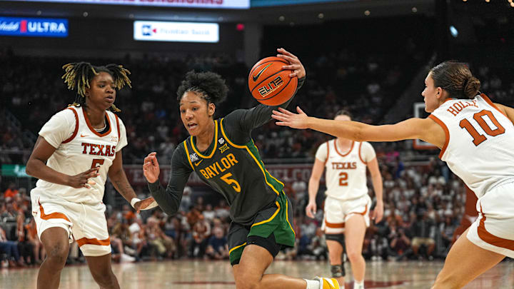 February 27, 2023; Austin, TX; Baylor guard Darianna Littlepage-Buggs pushes past Texas Longhorns