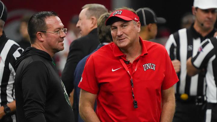 Dec 23, 2025; Frisco, TX, USA; Ohio Bobcats interim head coach John Hauser and UNLV Rebels head coach Dan Mullen talk on the field prior to game at the Ford Center at The Star. Mandatory Credit: Raymond Carlin III-Imagn Images Dec 23, 2025; Frisco, TX, USA; Ohio Bobcats interim head coach John Hauser and UNLV Rebels head coach Dan Mullen talk on the field prior to game at the Ford Center at The Star. Mandatory Credit: Raymond Carlin III-Imagn Images