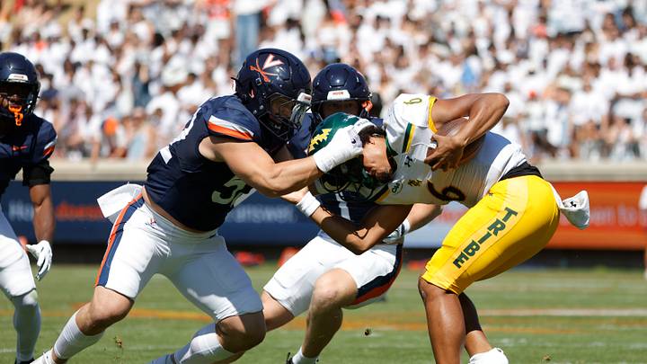 Sep 13, 2025; Charlottesville, Virginia, USA; William & Mary Tribe quarterback Tyler Hughes (6) is sacked by Virginia Cavaliers defensive lineman Daniel Rickert (52) ball against the Virginia Cavaliers during the second quarter at Scott Stadium. Mandatory Credit: Amber Searls-Imagn Images Sep 13, 2025; Charlottesville, Virginia, USA; William & Mary Tribe quarterback Tyler Hughes (6) is sacked by Virginia Cavaliers defensive lineman Daniel Rickert (52) ball against the Virginia Cavaliers during the second quarter at Scott Stadium. Mandatory Credit: Amber Searls-Imagn Images