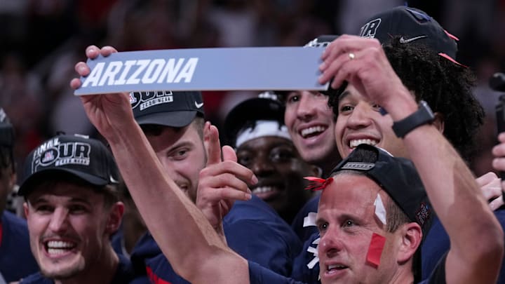 Arizona Wildcats athletic trainer Justin Kokoskie prepares to move the team’s name in the bracket after winning a NCAA Tournament game against the Purdue Boilermakers on Saturday, March 28, 2026 at SAP Center in San Jose, Calif. Purdue fell to Arizona 79-64.