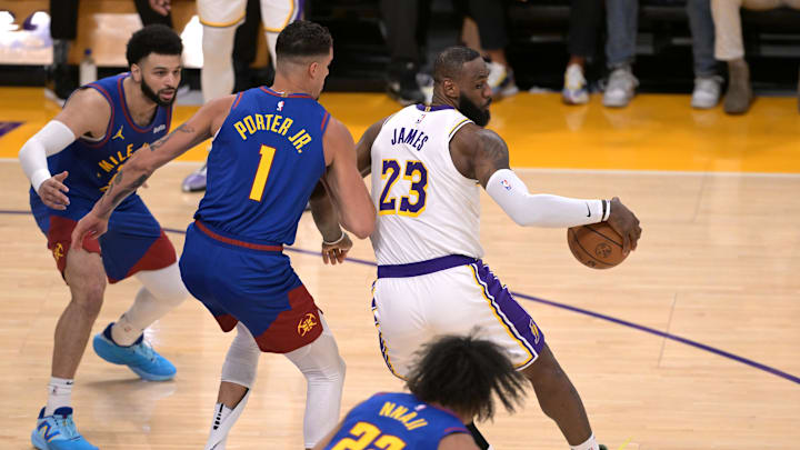 Mar 2, 2024; Los Angeles, California, USA; Los Angeles Lakers forward LeBron James (23) gets past Denver Nuggets forward Michael Porter Jr. (1). Mar 2, 2024; Los Angeles, California, USA; Los Angeles Lakers forward LeBron James (23) gets past Denver Nuggets forward Michael Porter Jr. (1).