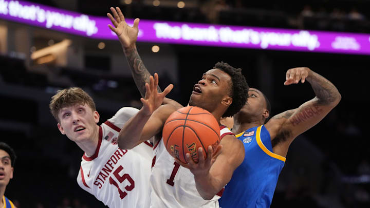 Mar 10, 2026; Charlotte, NC, USA; Stanford Cardinal guard Ebuka Okorie (1) shoots as Pittsburgh Panthers guard Damarco Minor (7) defends in the second half at Spectrum Center. Mandatory Credit: Bob Donnan-Imagn Images