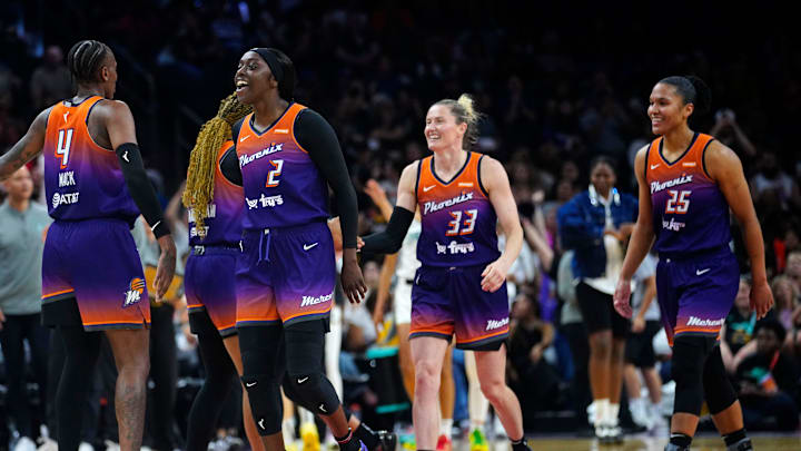 Mercury guard Kahleah Copper (2), Sami Whitcomb (33) and Alyssa Thomas (25) celebrate against the Liberty during a game in Phoenix, at PHX Arena on June 27, 2025.