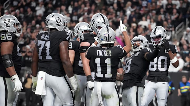 Dec 22, 2024; Paradise, Nevada, USA; Las Vegas Raiders running back Ameer Abdullah (8) celebrates with wide receiver Tre Tucker (11) and wide receiver Terrace Marshall Jr. (80) after scoring on a 7-yard touchdown run in the second half against the Jacksonville Jaguars at Allegiant Stadium. Mandatory Credit: Kirby Lee-Imagn Images