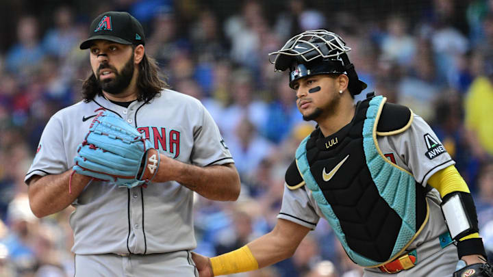 Aug 28, 2025; Milwaukee, Wisconsin, USA; Arizona Diamondbacks starting pitcher Nabil Crismatt (61) speaks with catcher Gabriel Moreno (14) during a pitching change against the Milwaukee Brewers in the sixth inning at American Family Field. Mandatory Credit: Benny Sieu-Imagn Images Aug 28, 2025; Milwaukee, Wisconsin, USA; Arizona Diamondbacks starting pitcher Nabil Crismatt (61) speaks with catcher Gabriel Moreno (14) during a pitching change against the Milwaukee Brewers in the sixth inning at American Family Field. Mandatory Credit: Benny Sieu-Imagn Images