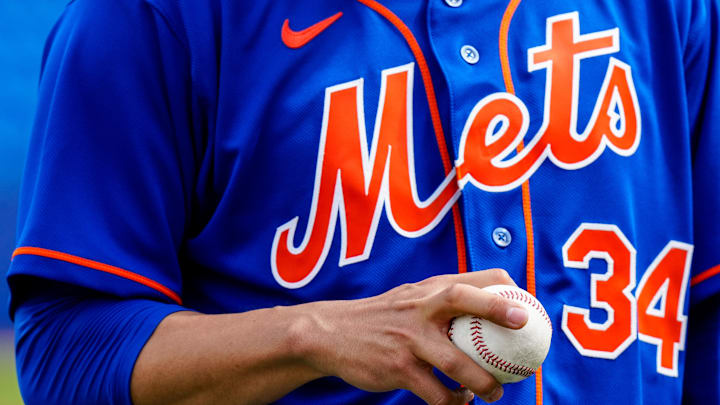 Feb 19, 2023; Port St. Lucie, FL, USA; New York Mets starting pitcher Kodai Senga (34) adjusts his