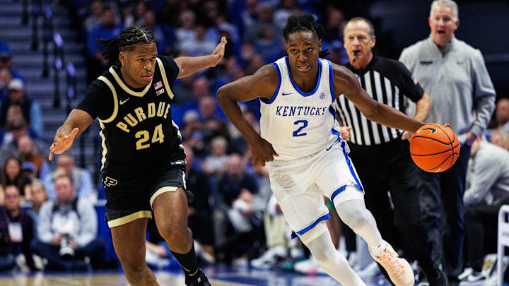 Oct 24, 2025; Lexington, KY, USA; Kentucky Wildcats guard Jasper Johnson (2) brings the ball up court against Purdue Boilermakers guard Gicarri Harris (24) during the second half at Rupp Arena at Central Bank Center. 