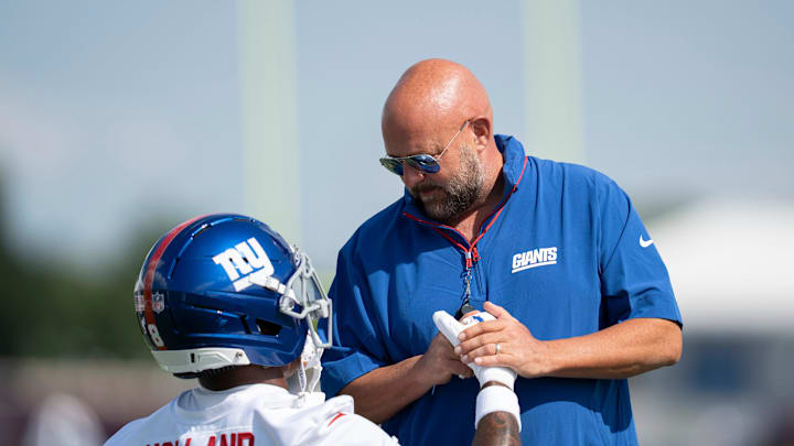 New York Giants Head Coach Brian Daboll speaks with New York Giants safety Jevon Holland (8) during day one of the New York Giants training camp. New York Giants Head Coach Brian Daboll speaks with New York Giants safety Jevon Holland (8) during day one of the New York Giants training camp.