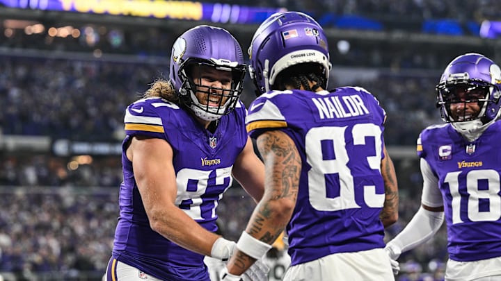 Minnesota Vikings tight end T.J. Hockenson (87) reacts with wide receiver Jalen Nailor (83) after Nailor scored a touchdown against the Green Bay Packers during the second quarter at U.S. Bank Stadium in Minneapolis on Dec. 29, 2024. Minnesota Vikings tight end T.J. Hockenson (87) reacts with wide receiver Jalen Nailor (83) after Nailor scored a touchdown against the Green Bay Packers during the second quarter at U.S. Bank Stadium in Minneapolis on Dec. 29, 2024.