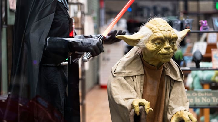 A life-size figure of Yoda from Star Wars is seen in the storefront at Whimsy Cellar in West Des Moines.