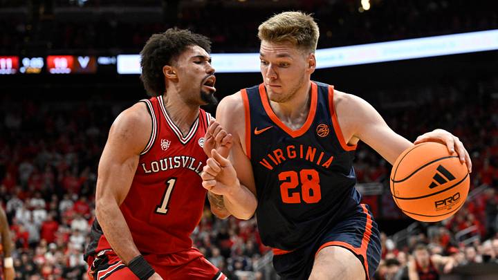 Jan 13, 2026; Louisville, Kentucky, USA; Virginia Cavaliers forward Thijs de Ridder (28) dribbles against Louisville Cardinals guard J'vonne Hadley (1) during the first half at KFC Yum! Center. Mandatory Credit: Jamie Rhodes-Imagn Images Jan 13, 2026; Louisville, Kentucky, USA; Virginia Cavaliers forward Thijs de Ridder (28) dribbles against Louisville Cardinals guard J'vonne Hadley (1) during the first half at KFC Yum! Center. Mandatory Credit: Jamie Rhodes-Imagn Images