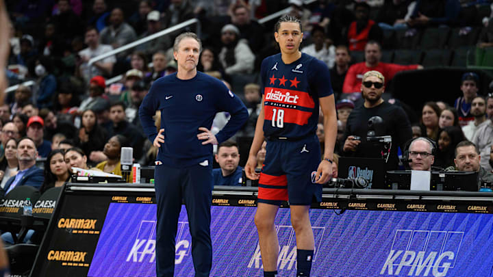 Mar 5, 2025; Washington, District of Columbia, USA; Washington Wizards head coach Brian Keefe looks on with forward Kyshawn George (18) during the fourth quarter against the Utah Jazz at Capital One Arena. Mandatory Credit: Reggie Hildred-Imagn Images