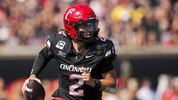 Oct 4, 2025; Cincinnati, Ohio, USA;  Cincinnati Bearcats quarterback Brendan Sorsby (2) runs with the ball as he looks to pass against the Iowa State Cyclones in the first half at Nippert Stadium. Mandatory Credit: Aaron Doster-Imagn Images
