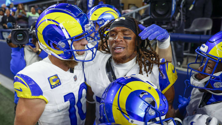 Nov 3, 2024; Seattle, Washington, USA; Los Angeles Rams wide receiver Demarcus Robinson (15, middle) celebrates with teammates, including wide receiver Cooper Kupp (10, left), after catching a game-wining touchdown pass against the Seattle Seahawks during overtime at Lumen Field. Mandatory Credit: Joe Nicholson-Imagn Images