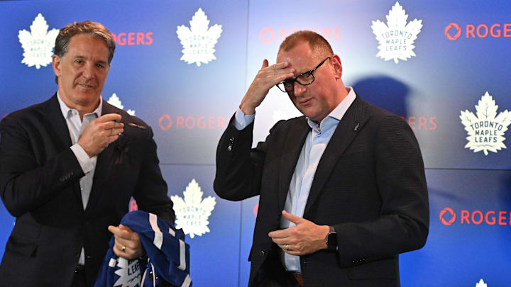 Jun 1, 2023; Toronto, Ontario, CANADA; Toronto Maple Leafs new general manager Brad Treliving is introduced by club president Brendan Shanahan (left) at a press conference at Scotiabank Arena. Mandatory Credit: Dan Hamilton-USA TODAY Sports
