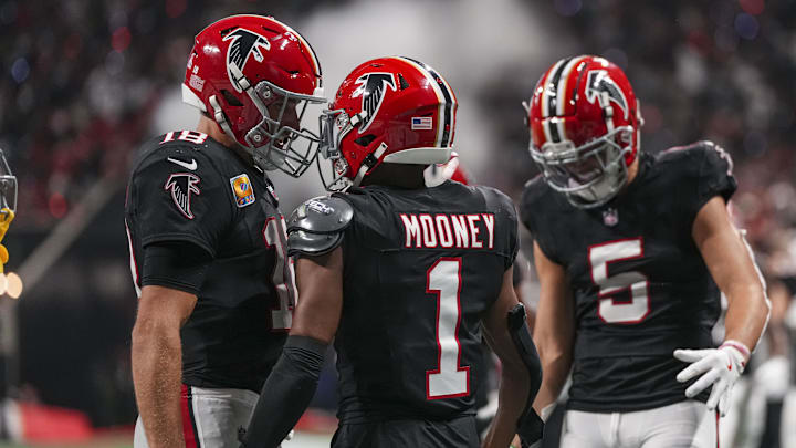 Kirk Cousins wasn't able to fully take advantage of Atlanta Falcons wide receivers Darnell Mooney (1) and Drake London (5) in 2024.
