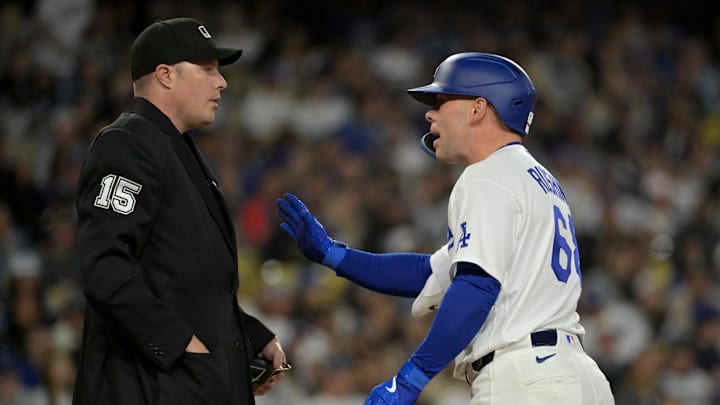 Apr 28, 2026; Los Angeles, California, USA; Los Angeles Dodgers catcher Dalton Rushing (68) argues with home plate umpire umpire Clint Vondrak (15) after he was called for strike 3 on a pitch clock violation -against the Miami Marlins at Dodger Stadium. Mandatory Credit: Jayne Kamin-Oncea-Imagn Images