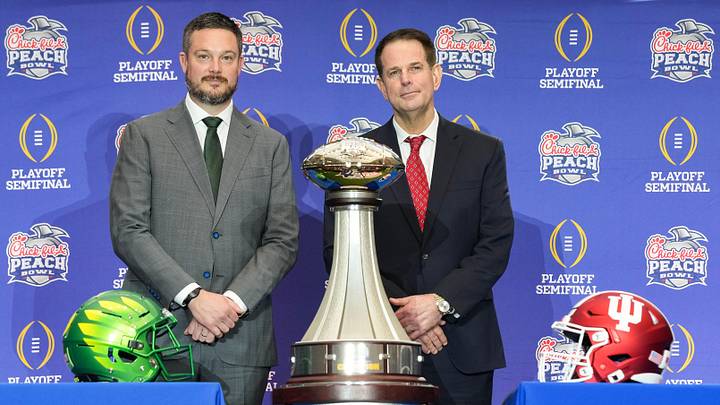 Oregon Ducks head coach Dan Lanning and Indiana Hoosiers head coach Curt Cignetti smile for a photo Thursday, Jan. 8, 2026, during a coaches' press conference ahead of the College Football Playoff Peach Bowl game at the College Football Hall of Fame in Atlanta. Oregon Ducks head coach Dan Lanning and Indiana Hoosiers head coach Curt Cignetti smile for a photo Thursday, Jan. 8, 2026, during a coaches' press conference ahead of the College Football Playoff Peach Bowl game at the College Football Hall of Fame in Atlanta.