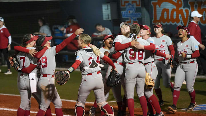 The Nebraska softball team celebrates defeating Tennessee during a NCAA super regional game between Tennessee and Nebraska at Sherri Parker Lee Stadium in Knoxville, Tenn., on May 23, 2025.