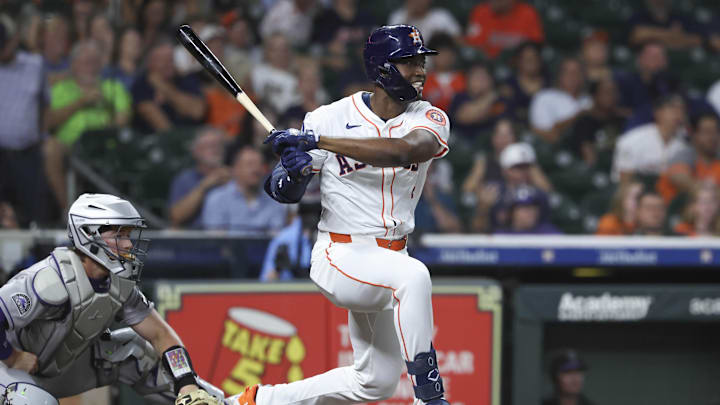 Aug 27, 2025; Houston, Texas, USA; Houston Astros left fielder Jesus Sanchez (4) hits an RBI single during the first inning against the Colorado Rockies at Daikin Park. Mandatory Credit: Troy Taormina-Imagn Images