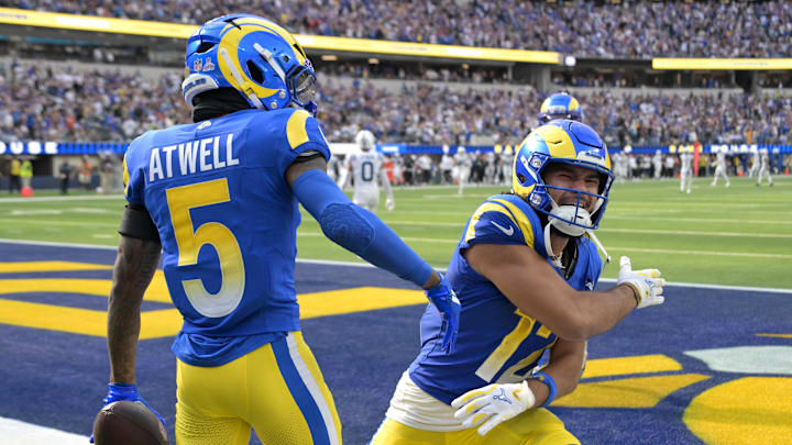 Sep 28, 2025; Inglewood, California, USA; Los Angeles Rams wide receiver Tutu Atwell (5) is congratulated by wide receiver Puka Nacua (12) after he ran for a touchdown on an 88-yard pass play in the fourth quarter against the Indianapolis Colts at SoFi Stadium. Mandatory Credit: Jayne Kamin-Oncea-Imagn Images