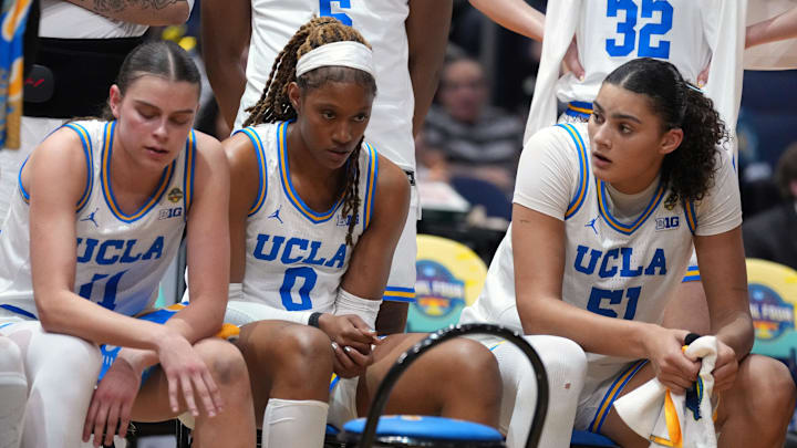 Apr 4, 2025; Tampa, FL, USA;  UCLA Bruins guard Gabriela Jaquez (11), forward Janiah Barker (0) and center Lauren Betts (51) react on the bench during the fourth quarter in a semifinal of the women's 2025 NCAA tournament against the Connecticut Huskies at Amalie Arena. Mandatory Credit: Kirby Lee-Imagn Images