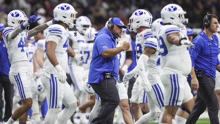 Dec 28, 2024; San Antonio, TX, USA; Brigham Young Cougars head coach Kalani Sitake reacts after a play during the second quarter against the Colorado Buffaloes at Alamodome. Mandatory Credit: Troy Taormina-Imagn Images Dec 28, 2024; San Antonio, TX, USA; Brigham Young Cougars head coach Kalani Sitake reacts after a play during the second quarter against the Colorado Buffaloes at Alamodome. Mandatory Credit: Troy Taormina-Imagn Images