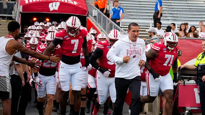 Sep 12, 2026; Madison, Wisconsin, USA;  Wisconsin Badgers head coach Luke Fickell leads the team onto the field for warmups prior to the game against the Western Illinois Leathernecks at Camp Randall Stadium. Mandatory Credit: Jeff Hanisch-Imagn Images