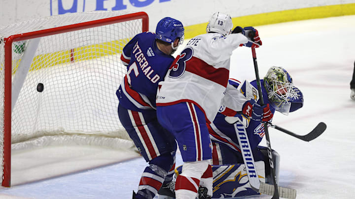 Amerks goalie Aaron Dell is pressure near the crease on this game winning goal by Laval  s Jean-Sebastien Dea int the 3rd overtime.  The Rockets win the North Division Finals 3 games to none.
