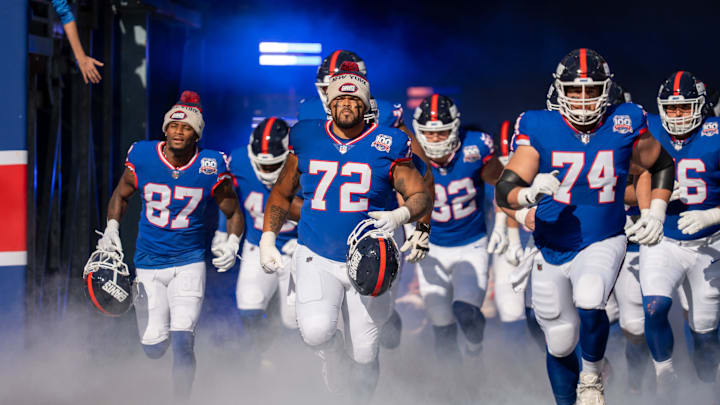 Members of the NY Giants run onto the field to start the game between the New York Giants and the Washington Commanders at MetLife Stadium in East Rutherford on Sunday, Nov. 3, 2024.
