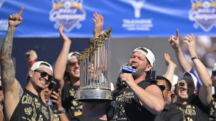 Nov 1, 2024; Los Angeles, CA, USA; starting pitcher Clayton Kershaw (22) lifts the World Series Championship Trophy during the team celebration at Dodger Stadium. Mandatory Credit: Jayne Kamin-Oncea-Imagn Images Nov 1, 2024; Los Angeles, CA, USA; starting pitcher Clayton Kershaw (22) lifts the World Series Championship Trophy during the team celebration at Dodger Stadium. Mandatory Credit: Jayne Kamin-Oncea-Imagn Images
