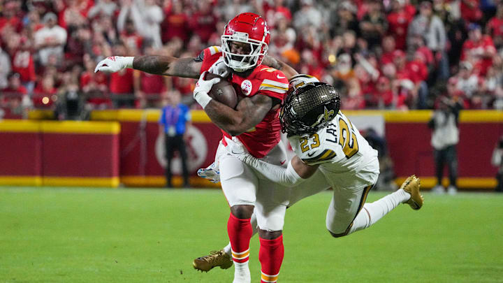 Oct 7, 2024; Kansas City, Missouri, USA; Kansas City Chiefs running back Samaje Perine (34) runs the ball as New Orleans Saints cornerback Marshon Lattimore (23) makes the tackle during the first half at GEHA Field at Arrowhead Stadium. Mandatory Credit: Denny Medley-Imagn Images Oct 7, 2024; Kansas City, Missouri, USA; Kansas City Chiefs running back Samaje Perine (34) runs the ball as New Orleans Saints cornerback Marshon Lattimore (23) makes the tackle during the first half at GEHA Field at Arrowhead Stadium. Mandatory Credit: Denny Medley-Imagn Images