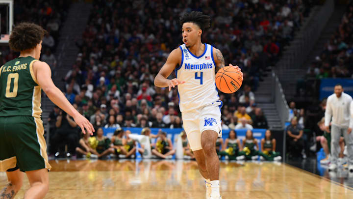 Mar 21, 2025; Seattle, WA, USA; Memphis Tigers guard PJ Haggerty (4) drives the ball during the second half against Colorado State Rams at Climate Pledge Arena. Mandatory Credit: Steven Bisig-Imagn Images