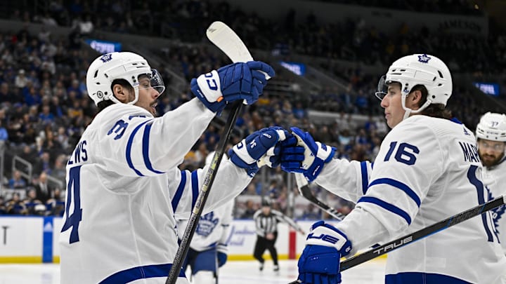Feb 19, 2024; St. Louis, Missouri, USA;  Toronto Maple Leafs center Auston Matthews (34) celebrates with right wing Mitchell Marner (16) after scoring against the St. Louis Blues during the third period at Enterprise Center. Mandatory Credit: Jeff Curry-Imagn Images