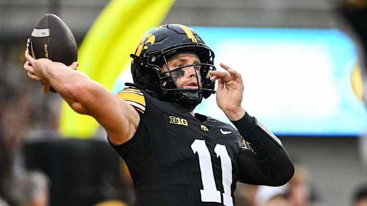Oct 18, 2025; Iowa City, Iowa, USA; Iowa Hawkeyes quarterback Mark Gronowski (11) warms up before the game against the Penn State Nittany Lions at Kinnick Stadium. Mandatory Credit: Jeffrey Becker-Imagn Images Oct 18, 2025; Iowa City, Iowa, USA; Iowa Hawkeyes quarterback Mark Gronowski (11) warms up before the game against the Penn State Nittany Lions at Kinnick Stadium. Mandatory Credit: Jeffrey Becker-Imagn Images