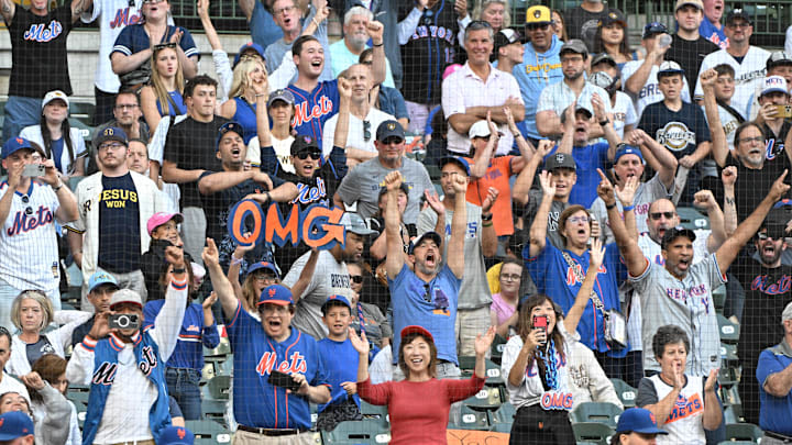 Sep 29, 2024; Milwaukee, Wisconsin, USA; New York Mets fans celebrate a 5-0 win over the Milwaukee Brewers at American Family Field. Mandatory Credit: Michael McLoone-Imagn Images
