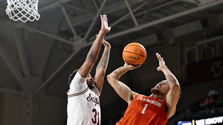 Mar 5, 2025; Chestnut Hill, Massachusetts, USA; Clemson Tigers guard Chase Hunter (1)  shoots against Boston College Eagles forward Elijah Strong (31) during the second half at Conte Forum. Mandatory Credit: Eric Canha-Imagn Images