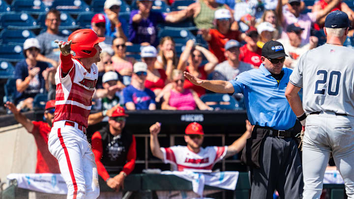 Jun 15, 2025; Omaha, Neb, USA; Louisville Cardinals designated hitter Garret Pike (2) celebrates after scoring on an error against the Arizona Wildcats during the eighth inning at Charles Schwab Field. Mandatory Credit: Dylan Widger-Imagn Images