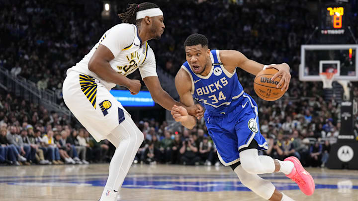Mar 15, 2025; Milwaukee, Wisconsin, USA;  Milwaukee Bucks forward Giannis Antetokounmpo (34) drives for the basket against Indiana Pacers center Myles Turner (33) during the fourth quarter at Fiserv Forum. Mandatory Credit: Jeff Hanisch-Imagn Images
