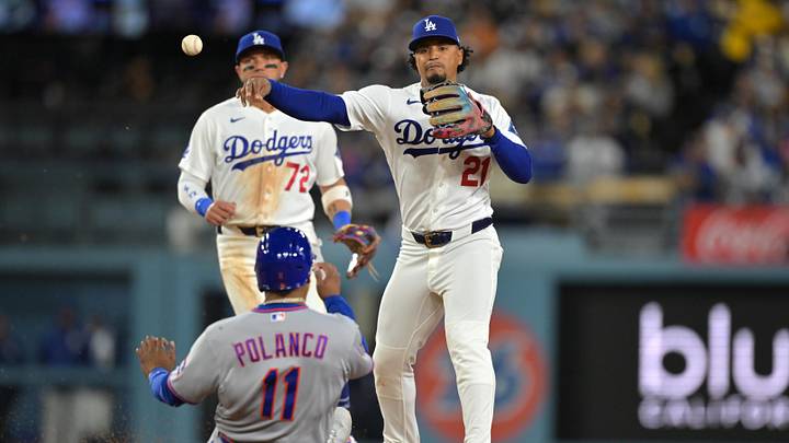 Apr 13, 2026; Los Angeles, California, USA; New York Mets second baseman Jorge Polanco (11) is out as Los Angeles Dodgers second baseman Santiago Espinal (21) throws to first for a double play in the fifth inning at Dodger Stadium. Mandatory Credit: Jayne Kamin-Oncea-Imagn Images Apr 13, 2026; Los Angeles, California, USA; New York Mets second baseman Jorge Polanco (11) is out as Los Angeles Dodgers second baseman Santiago Espinal (21) throws to first for a double play in the fifth inning at Dodger Stadium. Mandatory Credit: Jayne Kamin-Oncea-Imagn Images