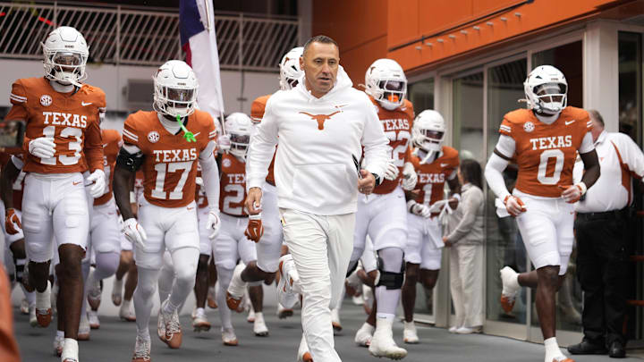 Texas Longhorns head coach Steve Sarkisian leads his team onto the field before a game against the Vanderbilt Commodores at Darrell K Royal-Texas Memorial Stadium.