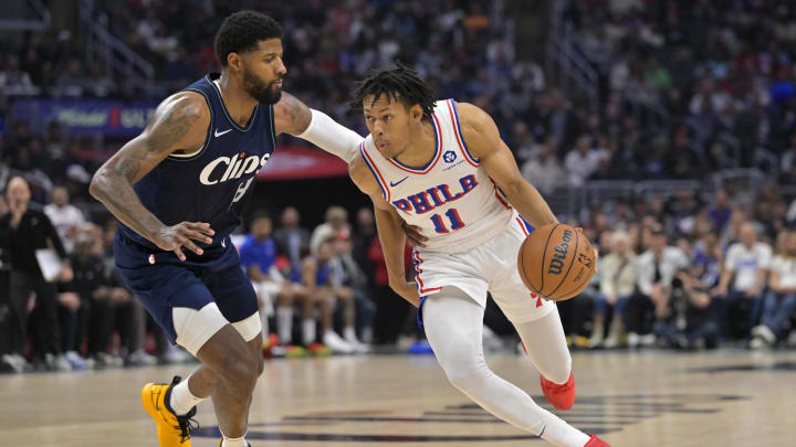 Mar 24, 2024; Los Angeles, California, USA;   Philadelphia 76ers guard Jeff Dowtin Jr., drives past